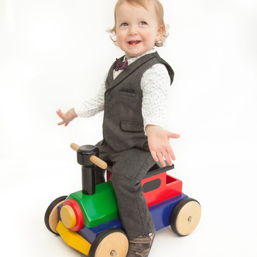 Child on wooden train toy - Cake Smash Photography - Walsall Wolverhampton and West Midlands - Jo Buckley Photography