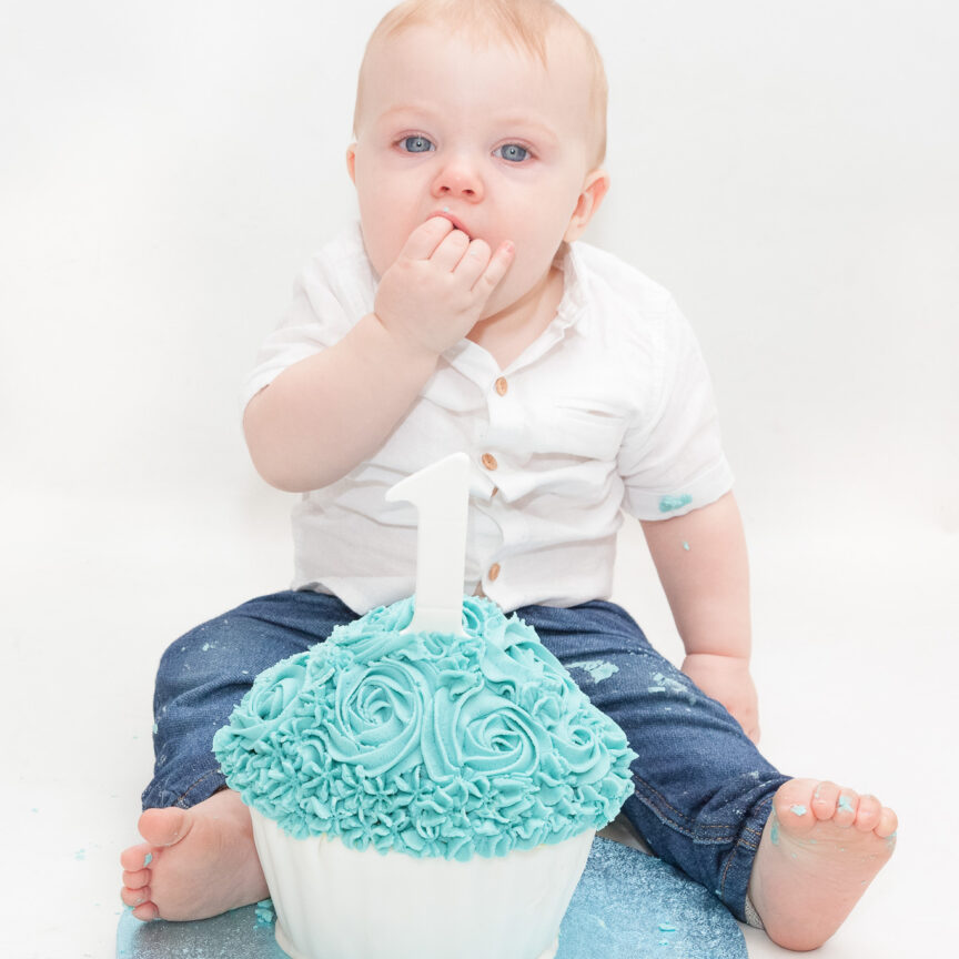 Child eating blue giant cupcake - Cake Smash Photography - Walsall Wolverhampton and West Midlands - Jo Buckley Photography