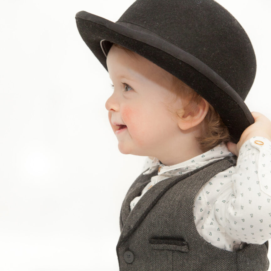 Side view of child in suit and bowler hat - Cake Smash Photography - Walsall Wolverhampton and West Midlands - Jo Buckley Photography