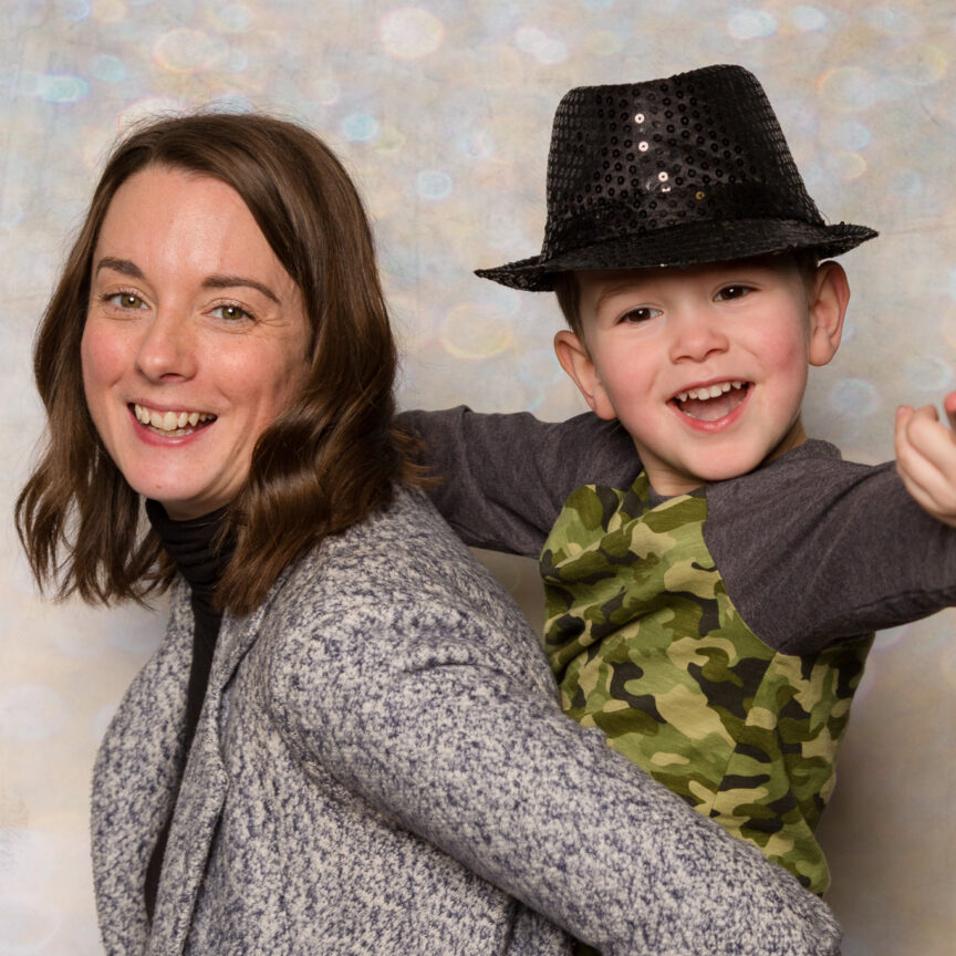 Child in hat on parents back on bokeh backdrop - Event Photography - Walsall Wolverhampton and West Midlands - Jo Buckley Photography