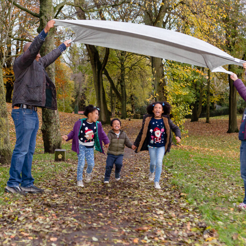 Kids running under blanket outdoors - Family Photography - Walsall Wolverhampton and West Midlands - Jo Buckley Photography