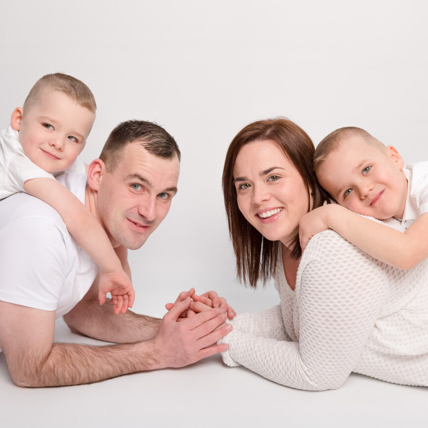 Parents on tummies with kids on backs in studio - Family Photography - Walsall Wolverhampton and West Midlands - Jo Buckley Photography