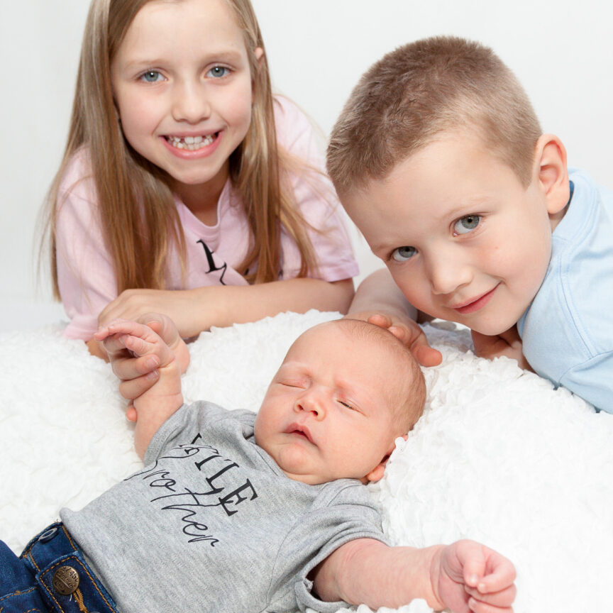 Siblings and baby on white blanket - Newborn Photography - Walsall Wolverhampton and West Midlands - Jo Buckley Photography