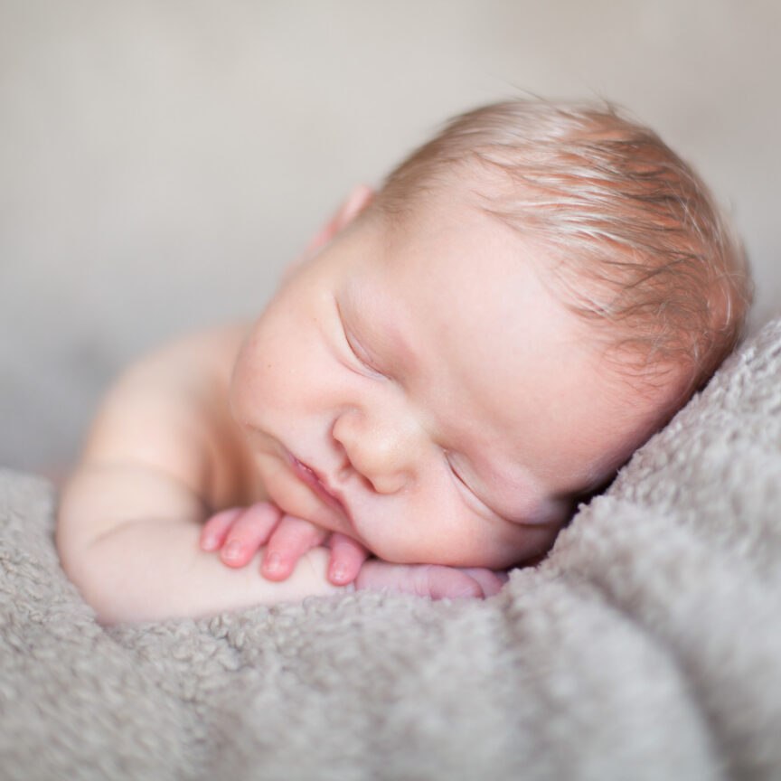 Close up of baby asleep on grey blanket - Newborn Photography - Walsall Wolverhampton and West Midlands - Jo Buckley Photography