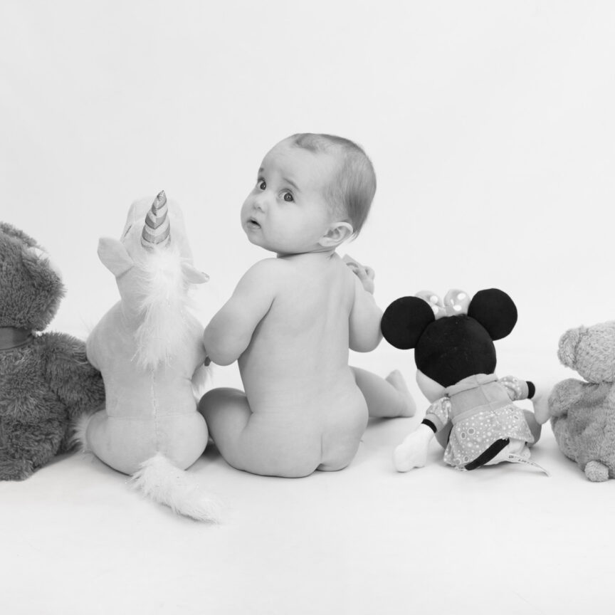 Black and white of baby and teddies from behind - Sitter Photography - Walsall Wolverhampton and West Midlands - Jo Buckley Photography