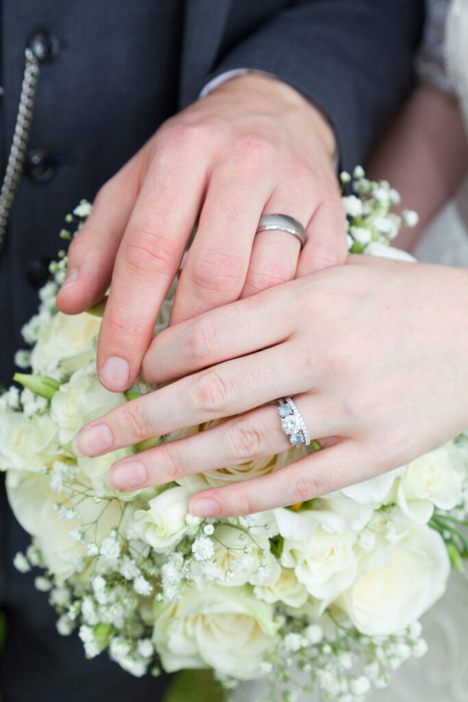 Close up of wedding couple hands and wedding rings - wedding photography - Jo Buckley Photography